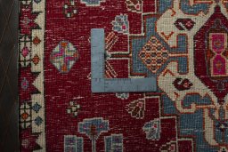 Backside of handmade 2000s Shiraz rug showing knot structure and weave density