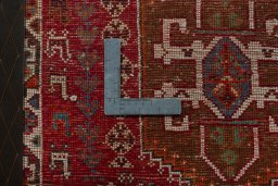 Backside of handmade 2000s Shiraz rug showing knot structure and weave density