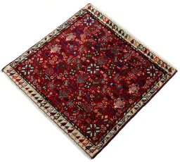 Corner detail of 2000s Shiraz rug showing border pattern and Wool pile