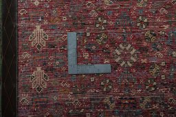 Backside of handmade 2000s Shiraz rug showing knot structure and weave density