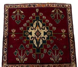 Surface texture of 2000s Shiraz rug with natural Wool and intricate pattern