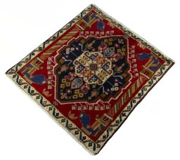 Corner detail of 2000s Shiraz rug showing border pattern and Wool pile