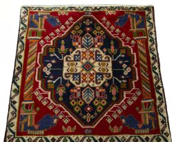 Surface texture of 2000s Shiraz rug with natural Wool and intricate pattern