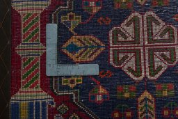 Backside of handmade 2000s Shiraz rug showing knot structure and weave density