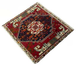 Corner detail of 2000s Shiraz rug showing border pattern and Wool pile