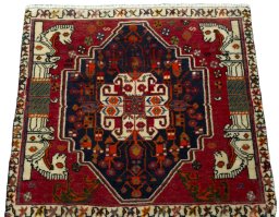 Surface texture of 2000s Shiraz rug with natural Wool and intricate pattern
