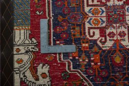 Backside of handmade 2000s Shiraz rug showing knot structure and weave density