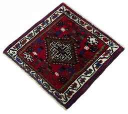 Corner detail of 2000s Shiraz rug showing border pattern and Wool pile