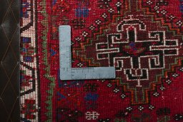 Backside of handmade 2000s Shiraz rug showing knot structure and weave density