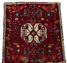 Surface texture of 2000s Shiraz rug with natural Wool and intricate pattern