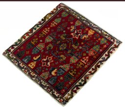 Corner detail of 2000s Shiraz rug showing border pattern and Wool pile