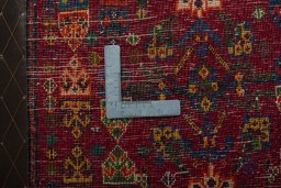 Backside of handmade 2000s Shiraz rug showing knot structure and weave density