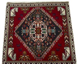 Surface texture of 2000s Shiraz rug with natural Wool and intricate pattern