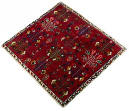 Corner detail of 2000s Shiraz rug showing border pattern and Wool pile
