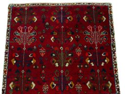 Surface texture of 2000s Shiraz rug with natural Wool and intricate pattern
