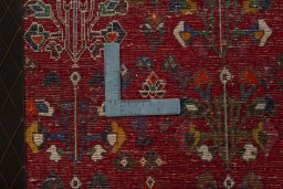 Backside of handmade 2000s Shiraz rug showing knot structure and weave density