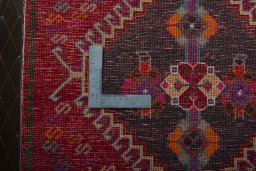 Backside of handmade 2000s Shiraz rug showing knot structure and weave density