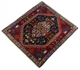 Corner detail of 2000s Shiraz rug showing border pattern and Wool pile