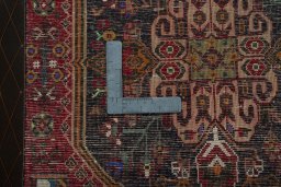 Backside of handmade 2000s Shiraz rug showing knot structure and weave density