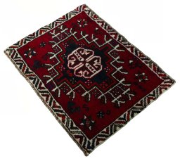 Corner detail of 2000s Shiraz rug showing border pattern and Wool pile