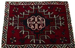 Surface texture of 2000s Shiraz rug with natural Wool and intricate pattern