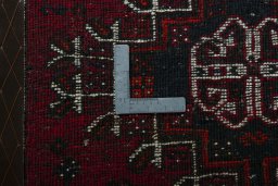 Backside of handmade 2000s Shiraz rug showing knot structure and weave density
