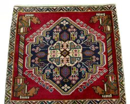 Surface texture of 2000s Shiraz rug with natural Wool and intricate pattern