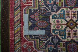 Backside of handmade 2000s Shiraz rug showing knot structure and weave density