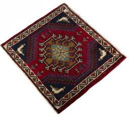 Corner detail of 2000s Shiraz rug showing border pattern and Wool pile