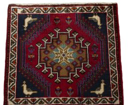 Surface texture of 2000s Shiraz rug with natural Wool and intricate pattern