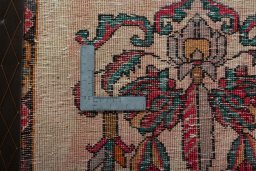 Backside of handmade 2000s Shiraz rug showing knot structure and weave density