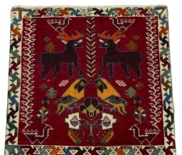 Surface texture of 2000s Shiraz rug with natural Wool and intricate pattern