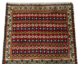 Surface texture of 2000s Shiraz rug with natural Wool and intricate pattern