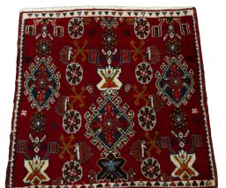 Surface texture of 2000s Shiraz rug with natural Wool and intricate pattern
