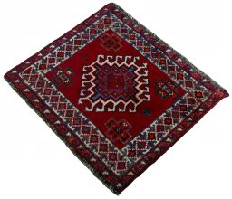 Corner detail of 2000s Shiraz rug showing border pattern and Wool pile