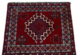 Surface texture of 2000s Shiraz rug with natural Wool and intricate pattern