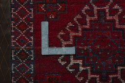 Backside of handmade 2000s Shiraz rug showing knot structure and weave density