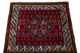 Surface texture of 2000s Shiraz rug with natural Wool and intricate pattern