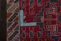 Backside of handmade 2000s Shiraz rug showing knot structure and weave density