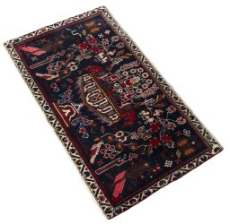 Corner detail of 2000s Shiraz rug showing border pattern and Wool pile