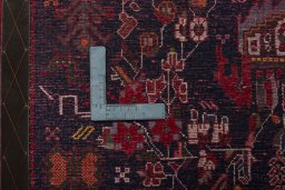Backside of handmade 2000s Shiraz rug showing knot structure and weave density