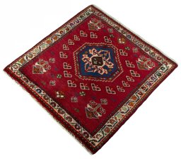 Corner detail of 2000s Shiraz rug showing border pattern and Wool pile