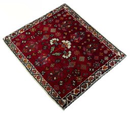 Corner detail of 2000s Shiraz rug showing border pattern and Wool pile