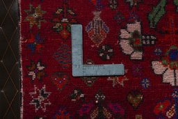 Backside of handmade 2000s Shiraz rug showing knot structure and weave density