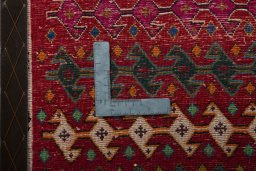 Backside of handmade 2000s Shiraz rug showing knot structure and weave density