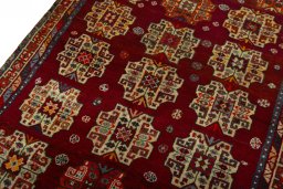 Backside of handmade 2000s Shiraz rug showing knot structure and weave density