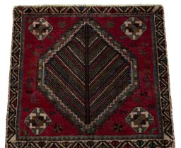 Surface texture of 2000s Shiraz rug with natural Wool and intricate pattern