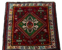Surface texture of 2000s Shiraz rug with natural Wool and intricate pattern