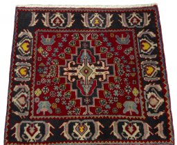 Surface texture of 2000s Shiraz rug with natural Wool and intricate pattern