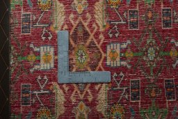 Backside of handmade 2000s Shiraz rug showing knot structure and weave density